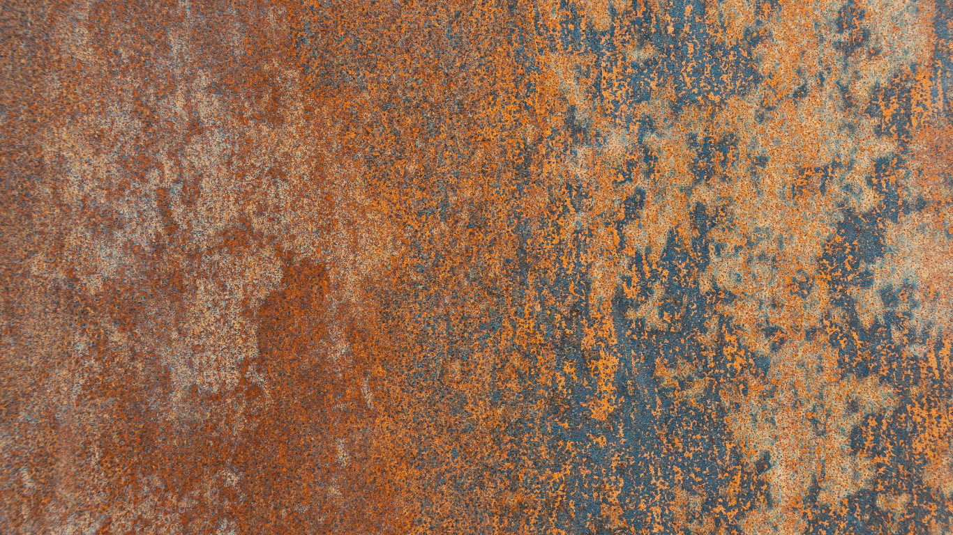 Rusty metal surface showing corrosion occurring in a corrosive environment, illustrating corrosion monitoring, corrosion control, and corrosion prevention using corrosion monitoring techniques such as corrosion probes, corrosion coupons, and basic corrosion rate measurements like weight loss and electrical resistance, where wall thickness and localized corrosion are easily assessed through visual inspection and measuring equipment to monitor erosion and corrosion deposits and prevent corrosion in process fluid systems.
