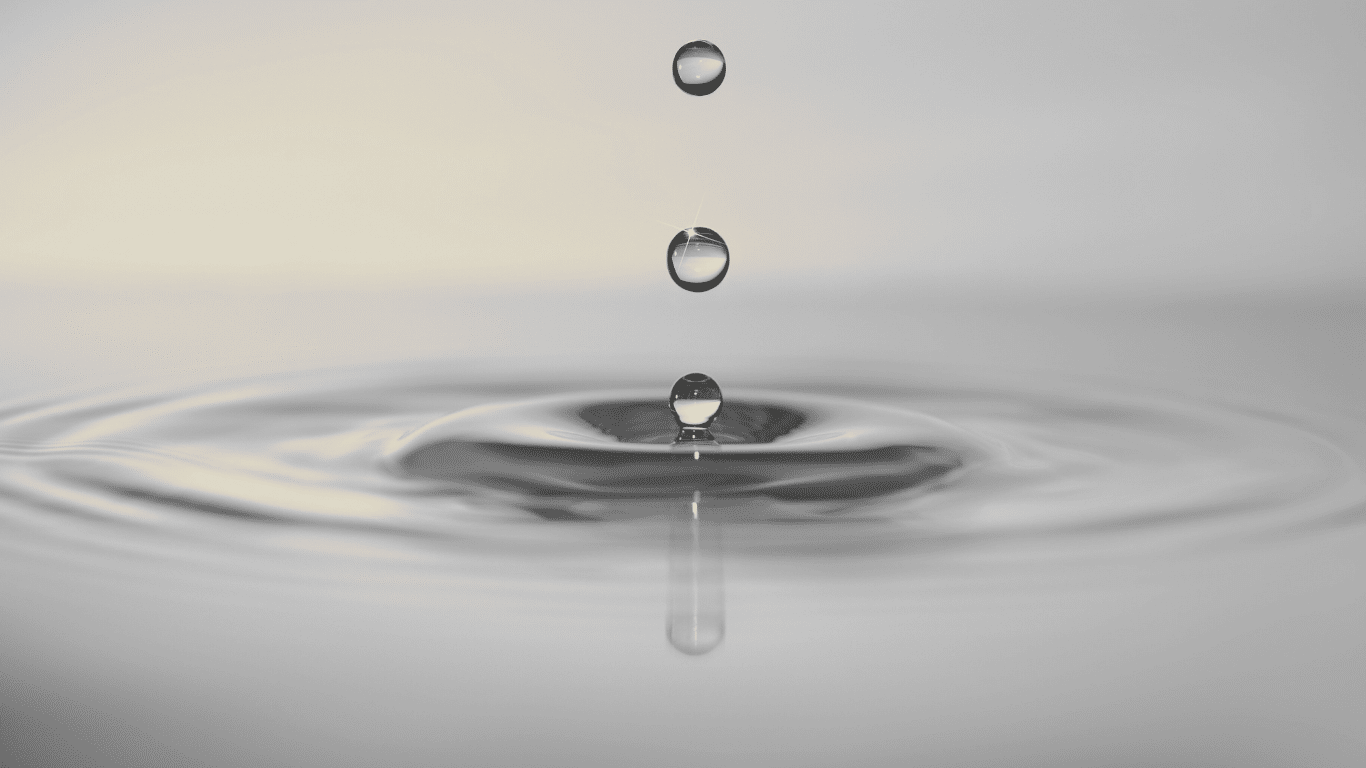 Zero liquid discharge system showing water droplet impact illustrating zero liquid discharge, zero liquid, zero discharge, zero liquid discharge zld, zld systems, zld technologies in industrial wastewater, wastewater stream, wastewater treatment, wastewater management, wastewater disposal, wastewater discharge, liquid discharge, liquid discharge system, liquid discharge treatment system, minimal liquid discharge, treated water, water recovery, water pollution control, industrial process using reverse osmosis, reverse osmosis system, membrane process, membrane distillation, forward osmosis, thermal processes, thermal evaporation, mechanical vapor compression, brine concentrators, brine management, brine management methods, brine treatment technologies, brine disposal, concentrated brine, dissolved solids, suspended solids, salt crystals recovery