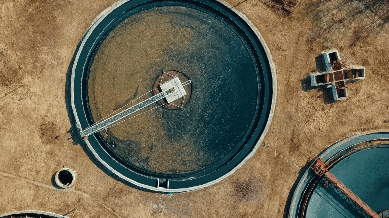 Aerial view of a circular water treatment basin used in desalination and freshwater production, showcasing advanced filters and components developed by a leading provider for government and military use, including army and naval research projects focused on sustainability and future technologies.