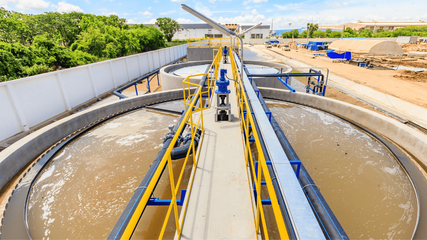 Circular wastewater treatment basins at a facility managing leachate from hazardous waste landfills, using reverse osmosis and evaporation methods to treat stormwater, reduce environmental footprints, and support safe recovery of water.