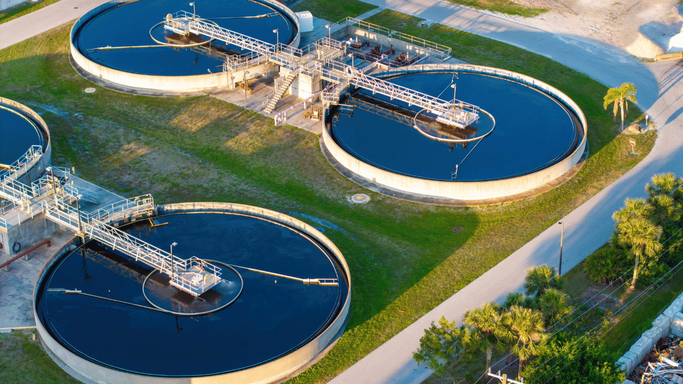This banner image shows a modern industrial water treatment in Atlanta facility with multiple circular clarifier tanks, advanced wastewater management systems, and large-scale water purification infrastructure designed for efficient industrial operations and environmental compliance.