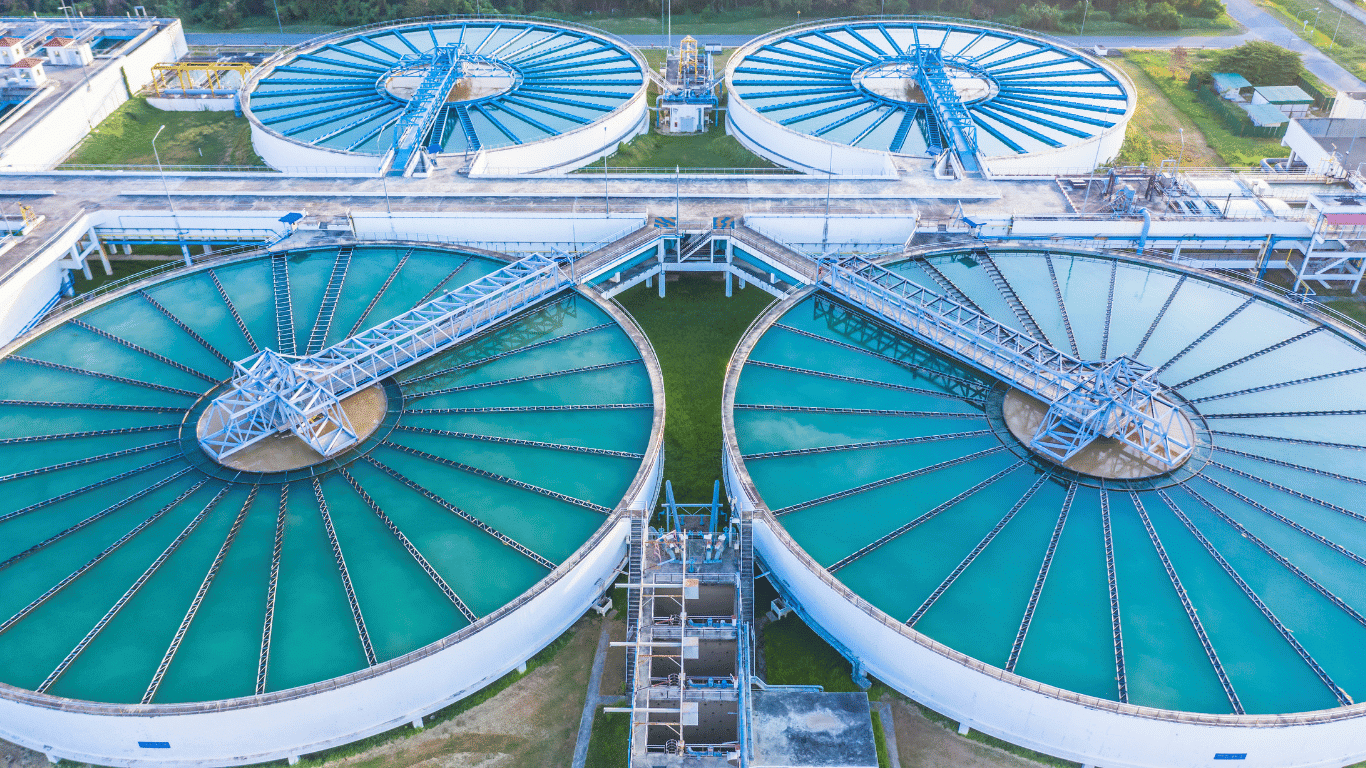 Advanced circular clarifier tanks at a facility specializing in Industrial Water Treatment operations, showing large-scale sedimentation basins and filtration systems used for municipal and commercial wastewater purification in Charlotte.