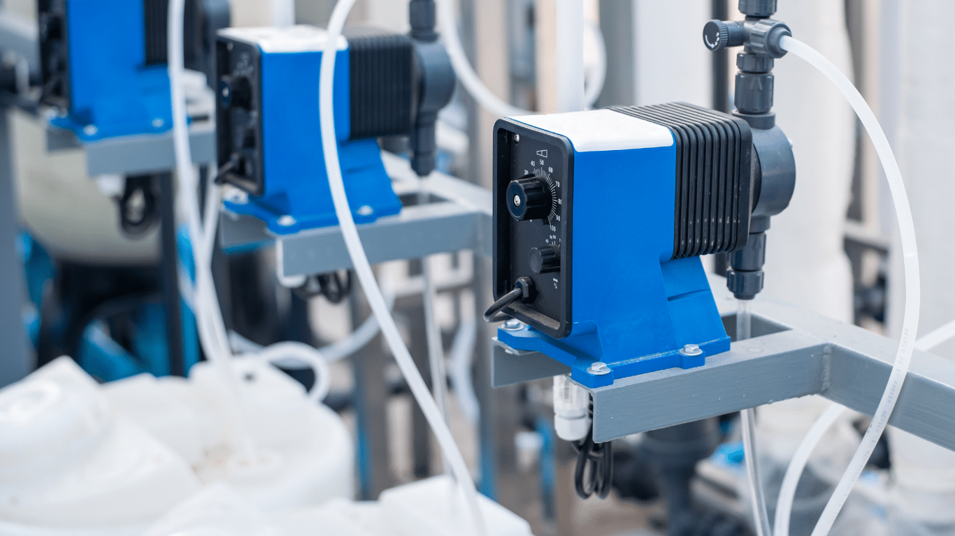 Industrial dosing pumps and a modern ph control system mounted on a control system frame for control ph in an aqueous solution process. The image shows ph sensors, ph probes, ph electrodes, control valves, a variable speed pump, and ph meters managing ph levels, ph values, and ph fluctuations inside a mixing tank used for nutrient solutions, plant growth, metal plating, and aquatic ecosystems. The setup helps determine hydrogen ion concentration on the ph scale and within the correct ph range for satisfactory ph control under acidic and alkaline conditions.