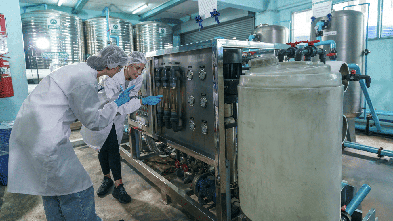 Technicians inspecting an industrial UF system with ultrafiltration membranes and hollow fiber membrane modules used in water treatment, wastewater treatment, and industrial water treatment for removing suspended solids, fine sediment, microscopic contaminants, and harmful substances from raw water during the ultrafiltration process before reverse osmosis systems and drinking water production.
