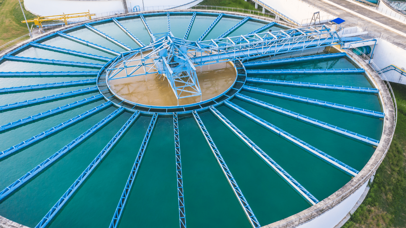 Industrial water treatment in Charleston featuring a large circular clarifier basin with advanced sedimentation and water purification systems viewed from above.