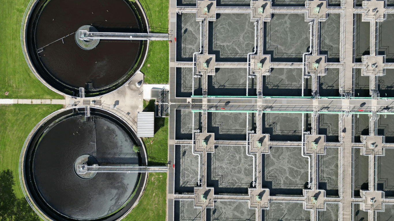 Aerial view of an industrial water treatment in Richmond facility featuring circular clarifiers and wastewater processing basins.