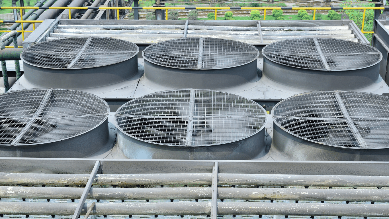 Industrial multi cell cooling tower with fan assemblies and tower fill, used in HVAC cooling towers, commercial HVAC systems, and industrial facilities to improve cooling efficiency, heat transfer efficiency, and overall energy efficiency through evaporative cooling.