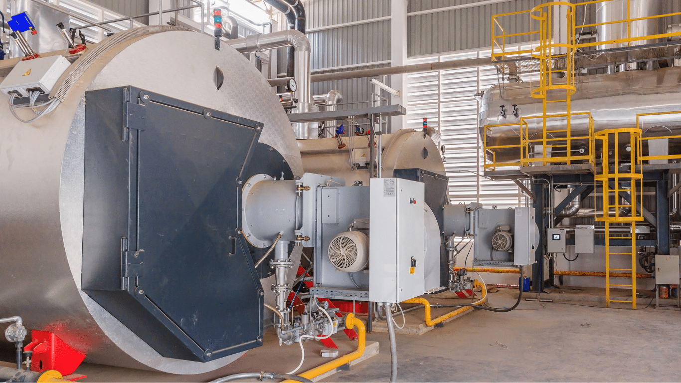 Industrial steam boiler plant featuring multiple horizontal fire tube boiler units with front-mounted burners, illustrating modern fire tube boiler designs used for steam generation. These industrial steam boilers operate as part of integrated steam boiler systems and a complete boiler system for industrial processes including food processing, chemical processing, and power generation. The gas fired boilers use natural gas, fuel oil, or other fossil fuels for fuel combustion inside the combustion chamber, where hot gases and combustion gases transfer heat through boiler tubes to heat water and generate steam. The resulting steam output delivers high pressure steam, pressure steam, or supports low pressure boilers depending on operational requirements. The system includes pressure relief valves, advanced control systems, and insulated piping for efficient steam systems, maximizing boiler efficiency, thermal efficiency, and energy efficiency while reducing fuel consumption. This industrial boiler installation demonstrates reliable steam production for demanding applications requiring precise temperature control.