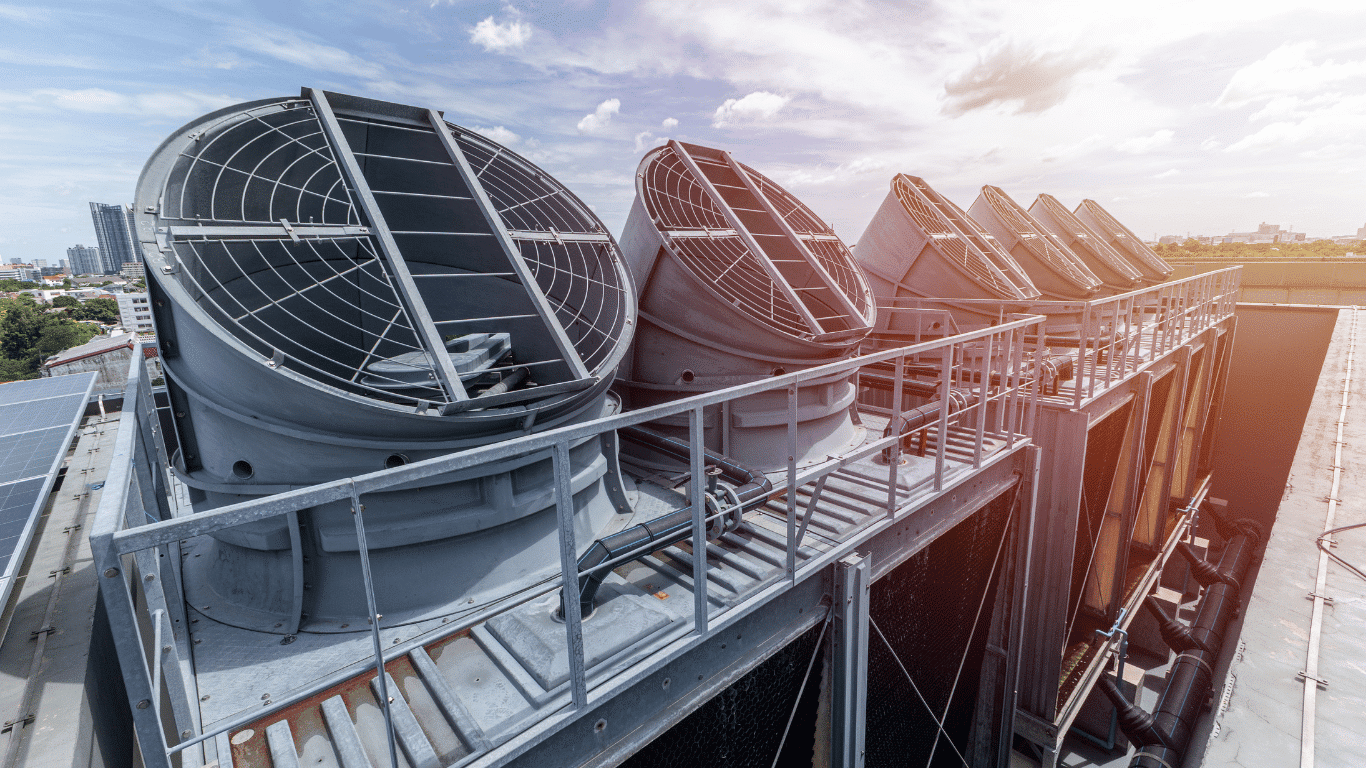 Industrial cooling tower fans and an air cooled condenser remove excess heat through efficient heat transfer in an industrial cooling system, improving heat rejection, performance, energy efficiency, refrigerant cooling, coolant circulation, air flow, and overall systems reliability.