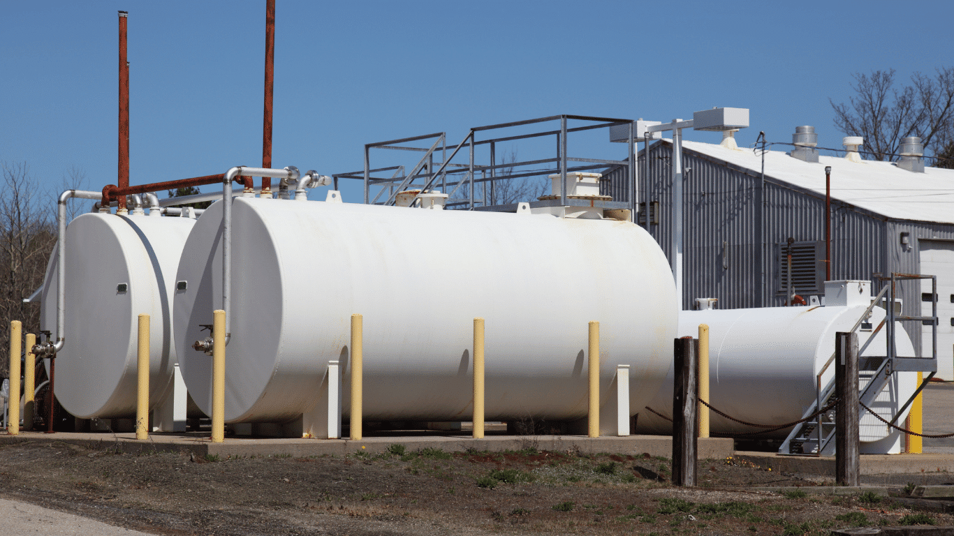 Industrial storage tanks at a water treatment facility, representing industrial tank cleaning, tank cleaning services, maintenance, cleaning, and safety practices that help protect water tanks and industrial systems from contamination.