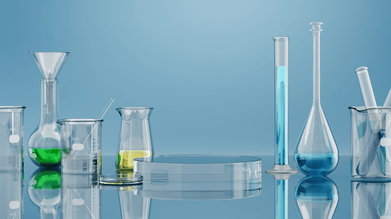 Laboratory glassware with colored solutions representing water treatment, water chemistry, pH adjustment chemicals, chemical reactions, and common chemicals used to raise pH, lower pH, and support pH control in treatment systems.