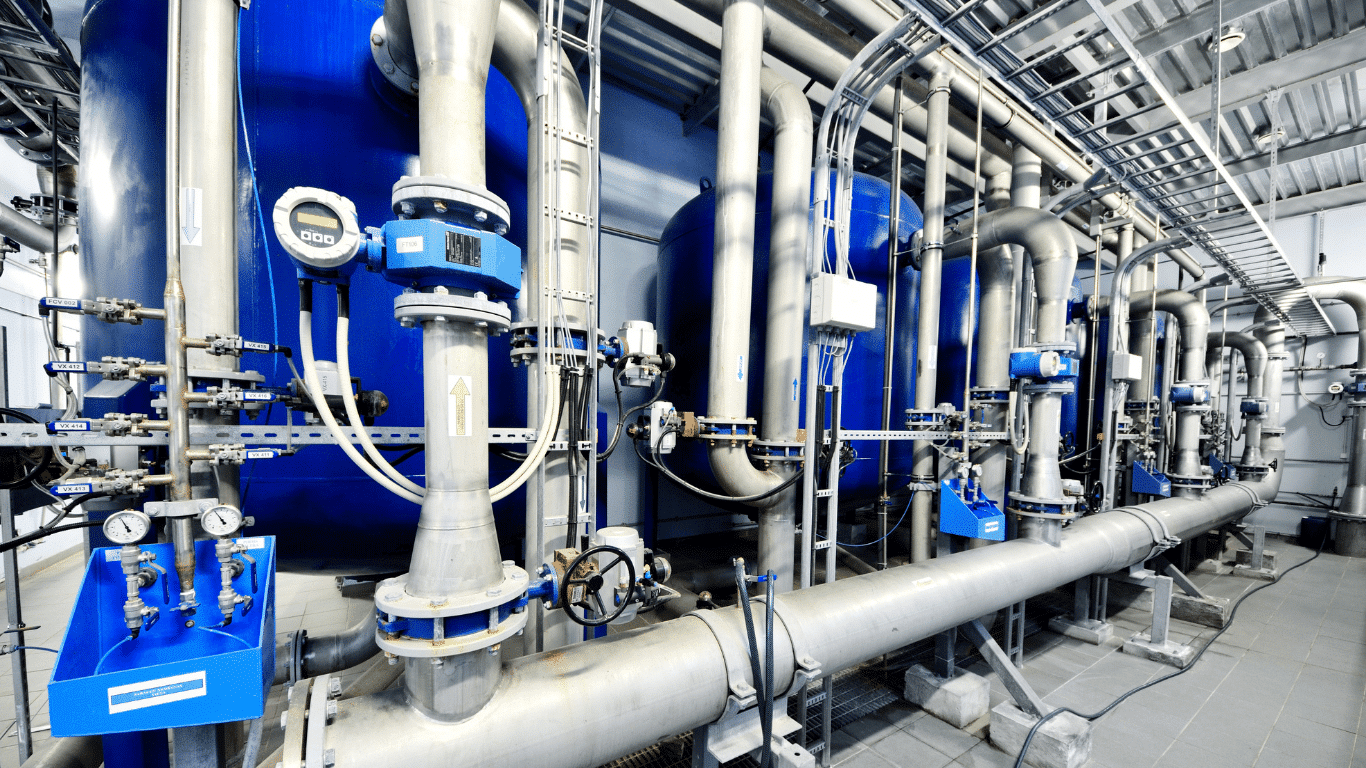 Industrial water treatment system using ion exchange resin beads inside ion exchange systems to remove dissolved ions during the ion exchange process for water treatment and water softening.