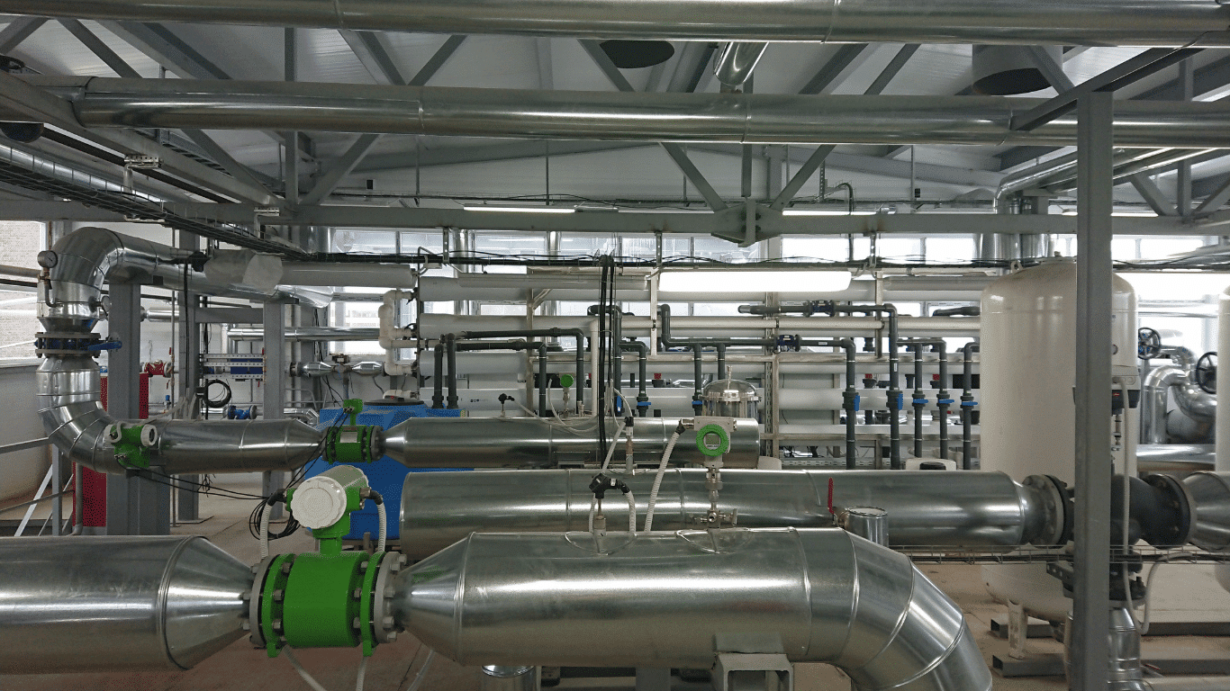 Industrial hospital water treatment equipment with stainless steel piping, reverse osmosis systems, water filtration systems, and treatment systems used to support healthcare facilities, medical facilities, and patient safety.