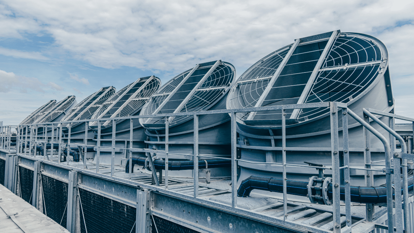 Hybrid cooling system equipment with large air-cooled units designed to manage heat, temperature, energy consumption, and system performance efficiently.