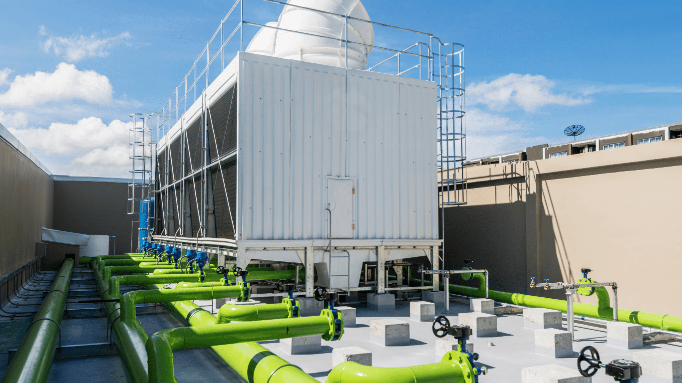 Makeup water for cooling tower with green piping, valves, and industrial cooling equipment