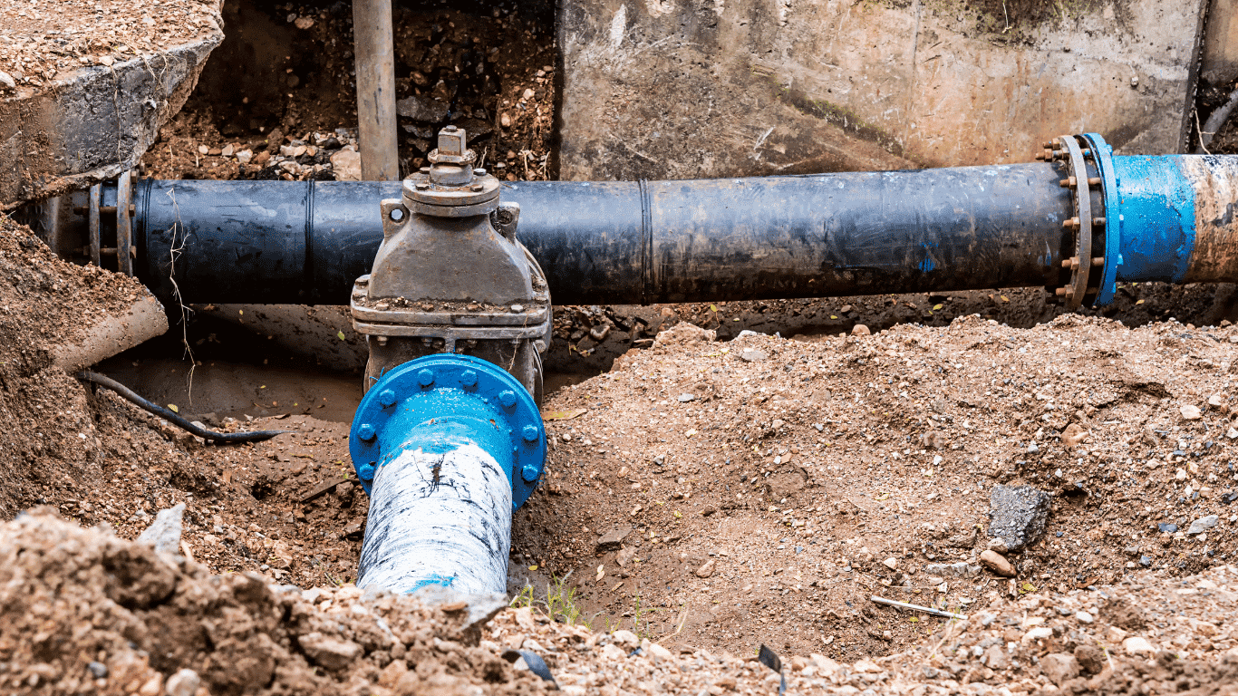 Industrial water system piping and valve illustrating scale inhibitor use, scale prevention, and industrial water treatment chemicals.