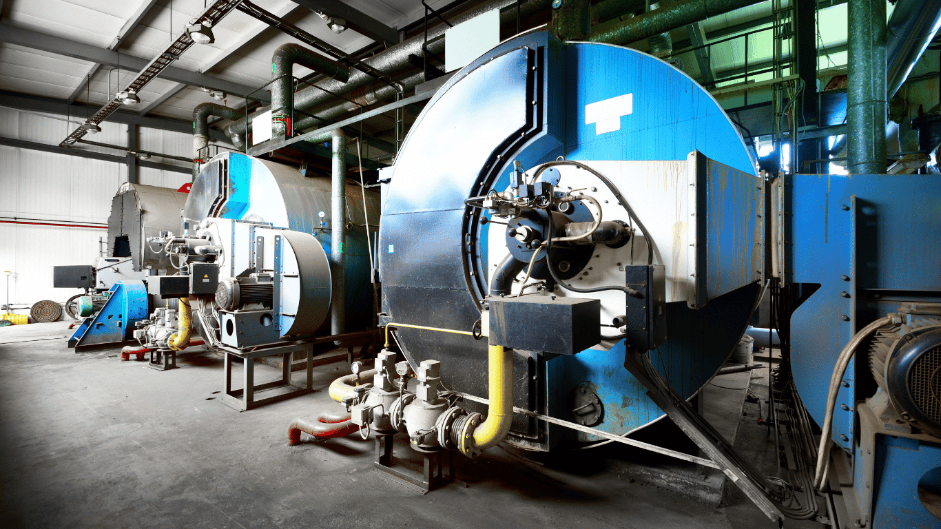 Industrial boilers in a plant facility with boiler systems, steam equipment, piping, and controls for boiler water treatment, feed water management, monitoring, and efficient operation.